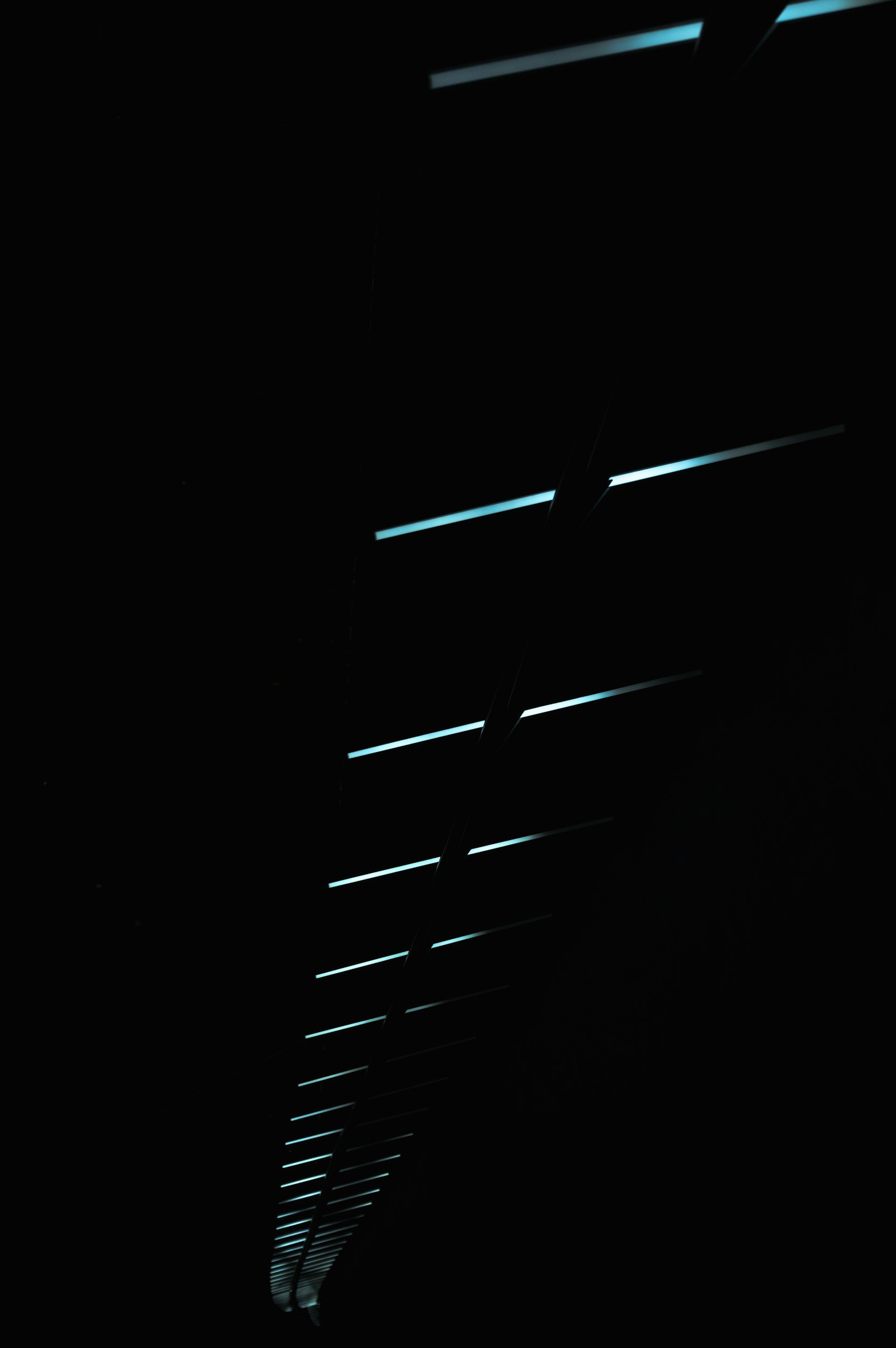 A dark, illuminated aerospace corridor